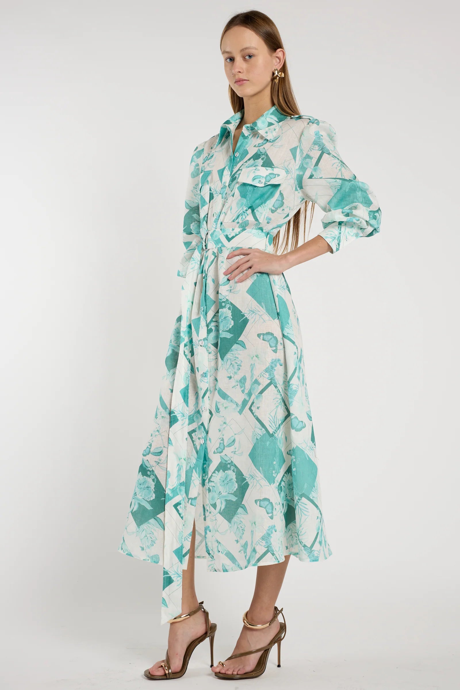 Woman wearing a floral dress with a white background
