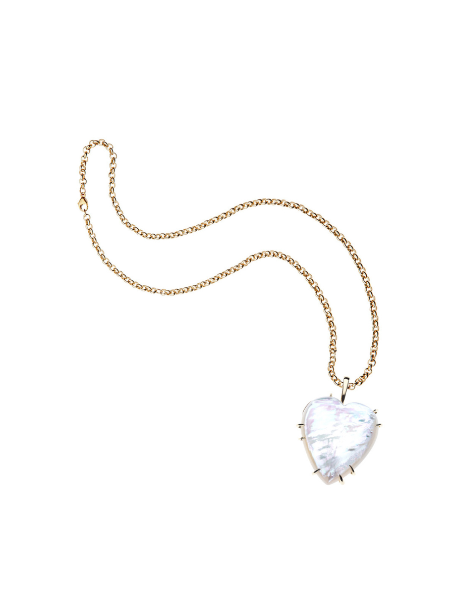 Gold necklace with a heart-shaped clear pendant on a white background