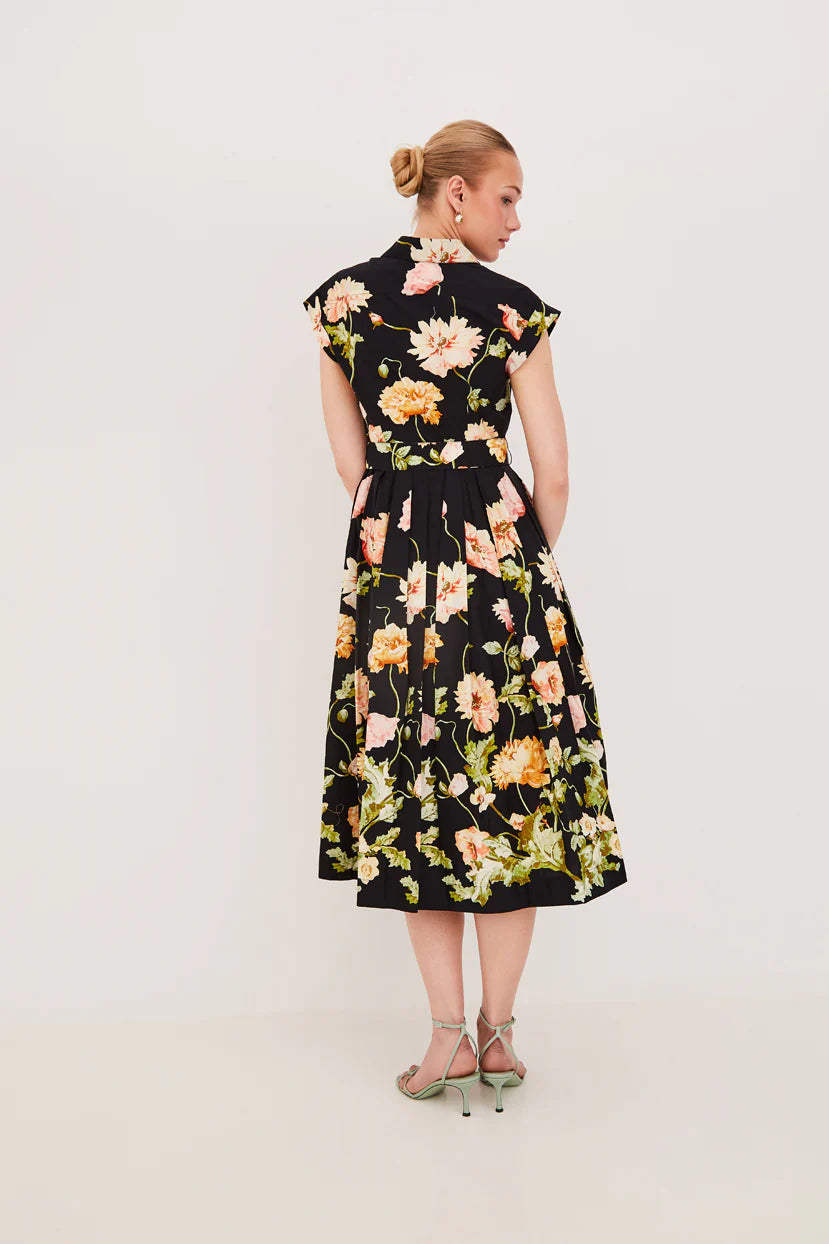 Woman wearing a floral dress on a white background