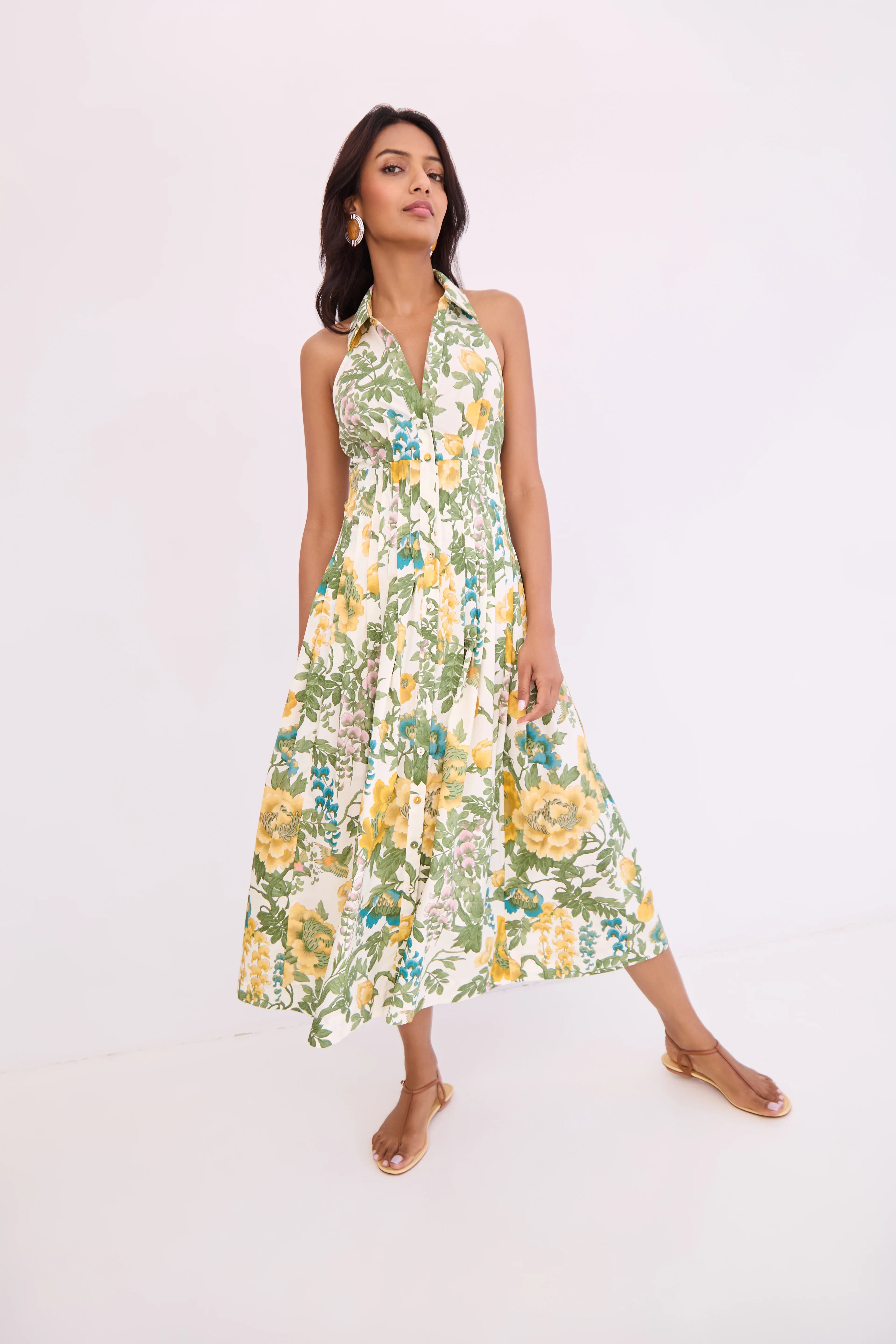 Woman wearing a floral dress on a white background