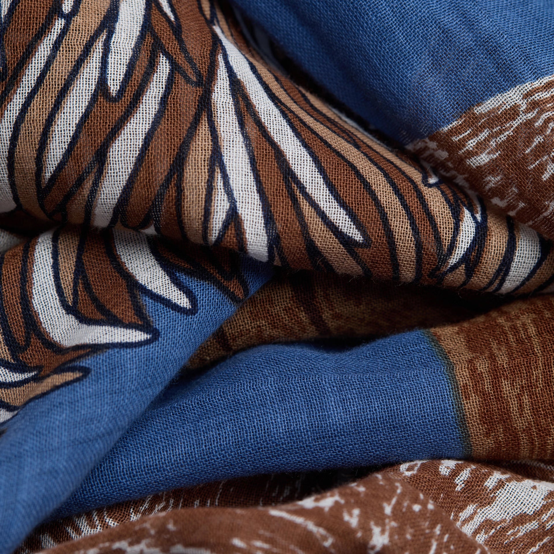 Close-up of fabric with brown, blue, and white pattern