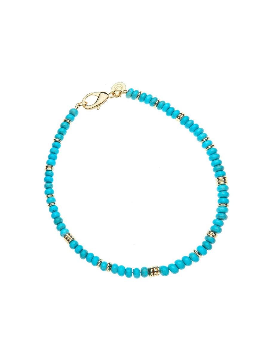 Turquoise beaded bracelet with gold accents on a white background