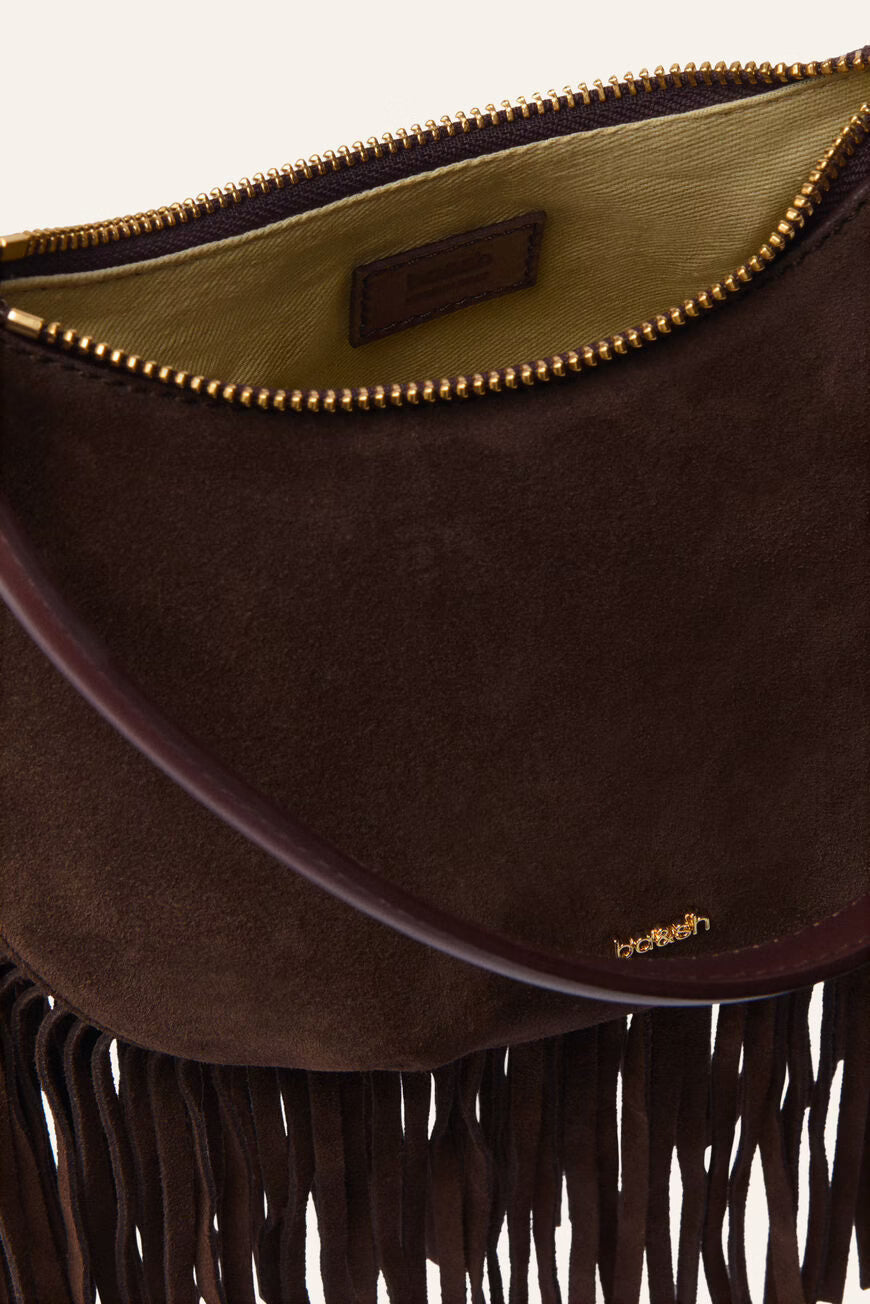 Brown suede handbag with fringe detail and visible brand logo on a white background