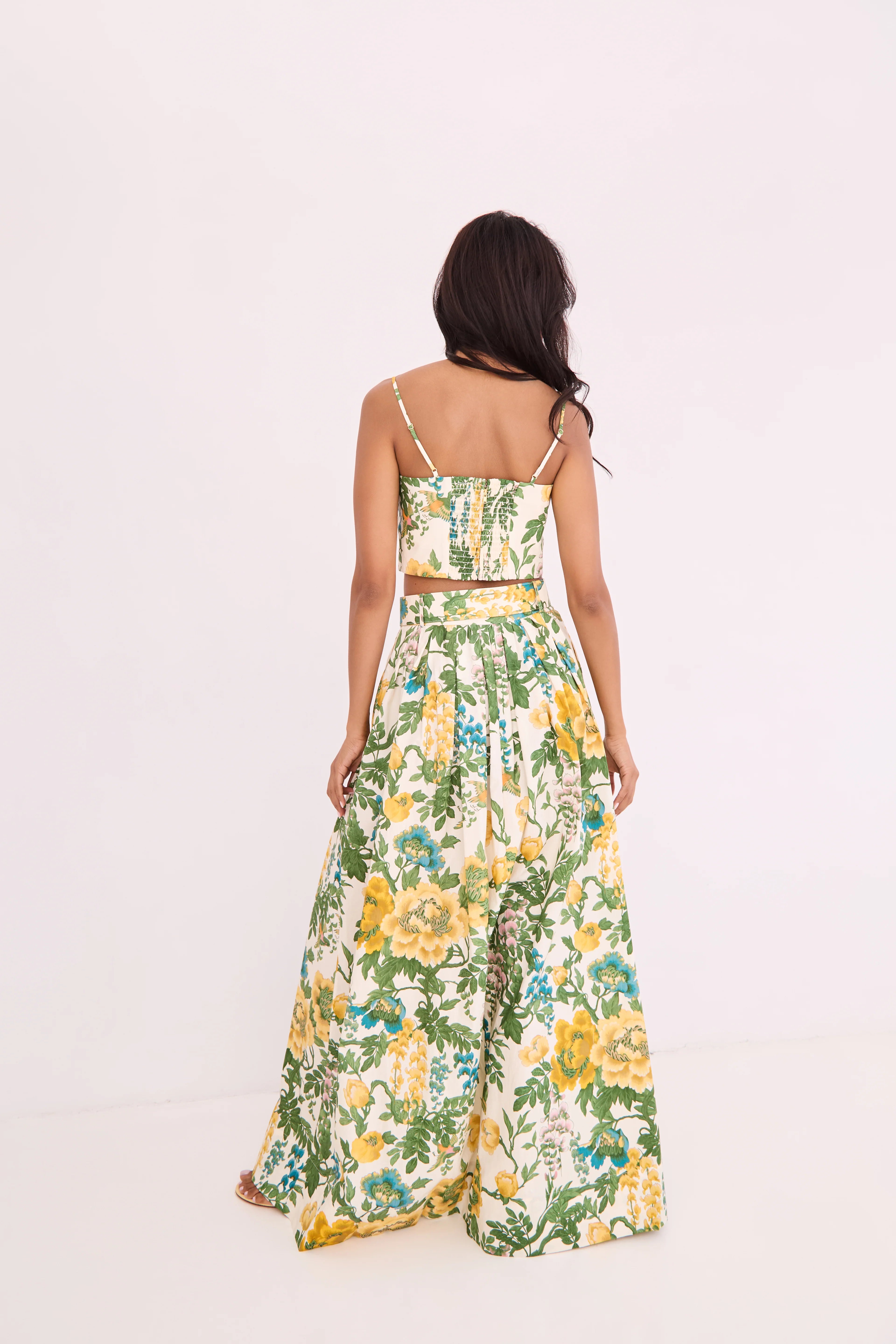 Woman wearing a floral dress on a white background