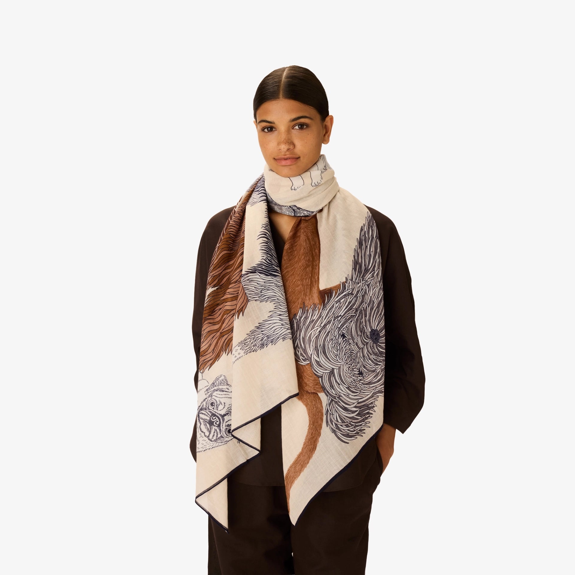 Woman wearing a patterned scarf with a white background