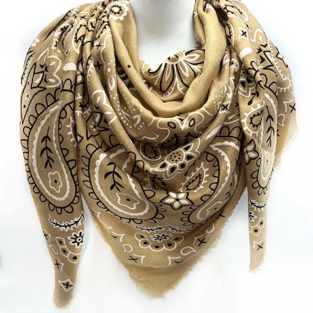 Beige bandana with black and white patterns on a white background