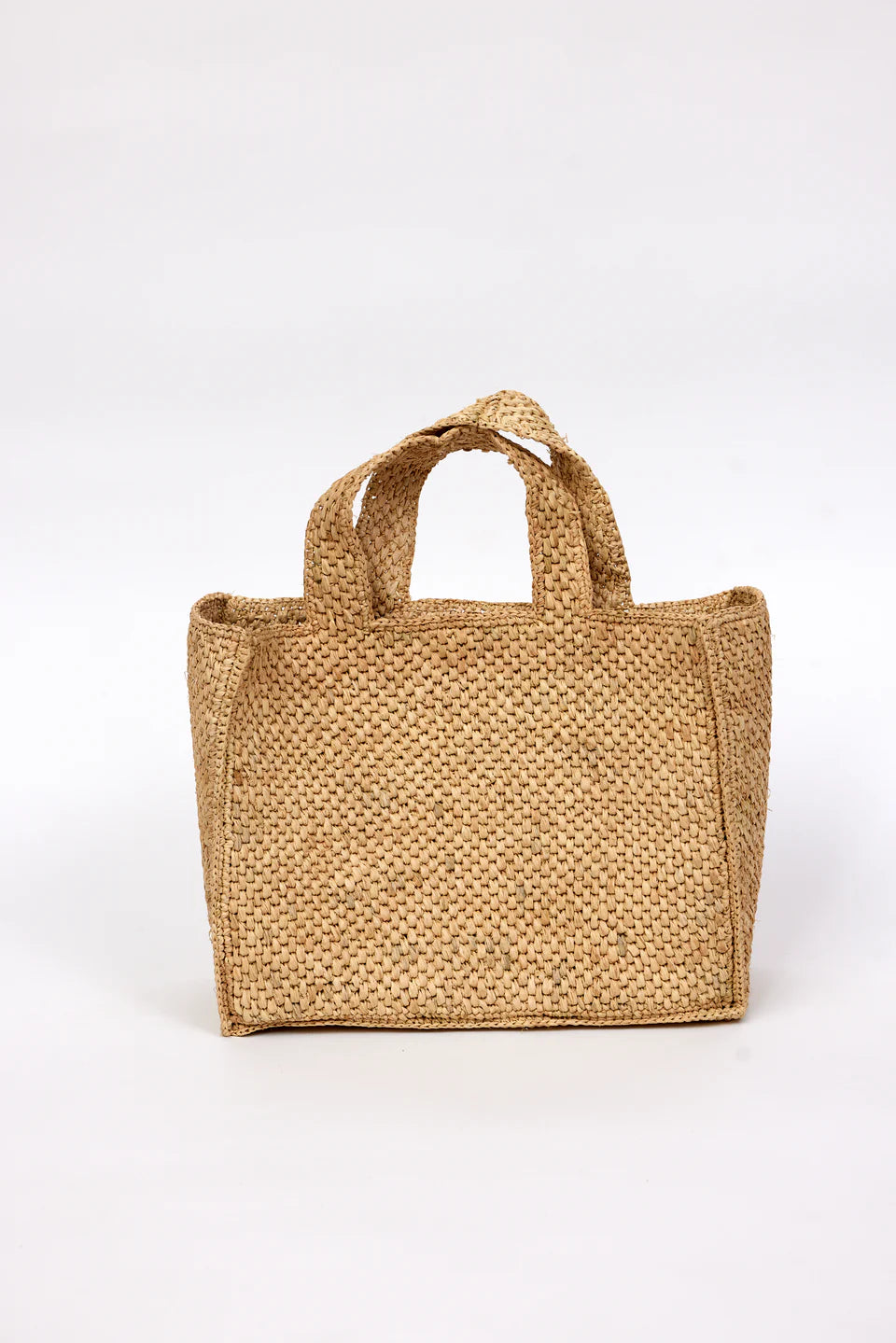 Woven brown bag on a white background