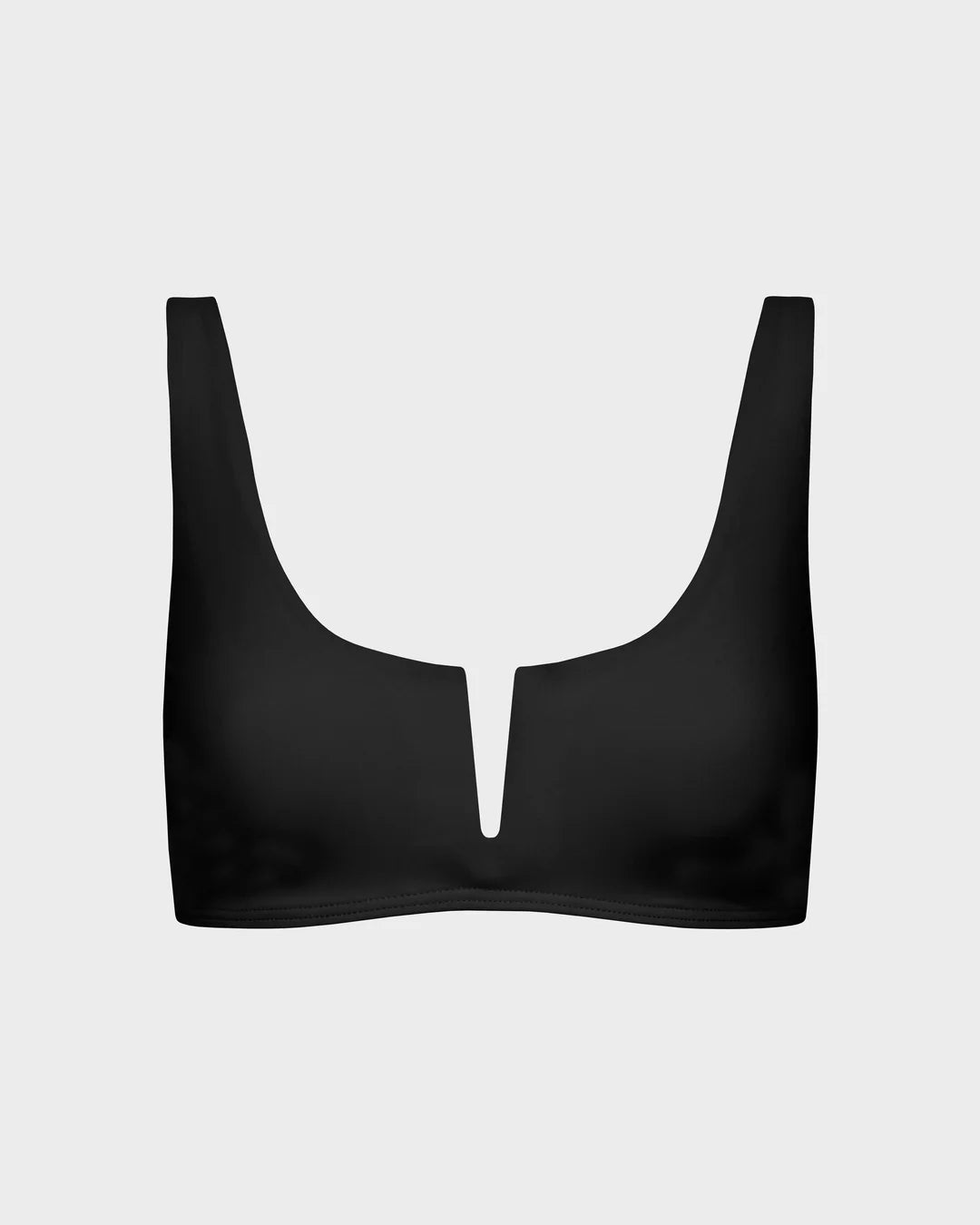 Black bralette on a light gray background