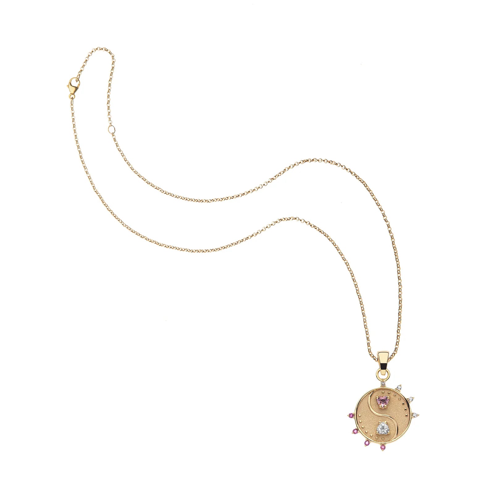 Gold necklace with a circular pendant on a white background