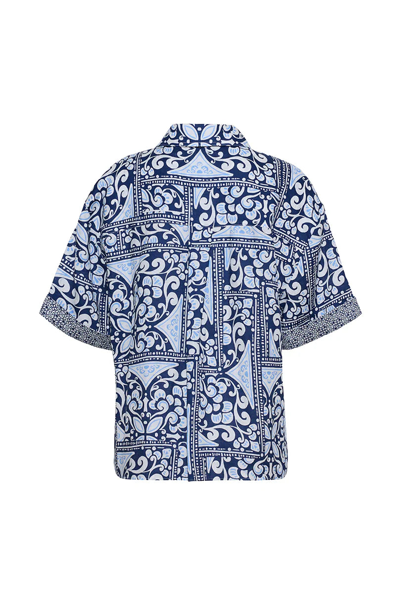 Blue and white patterned shirt on a white background