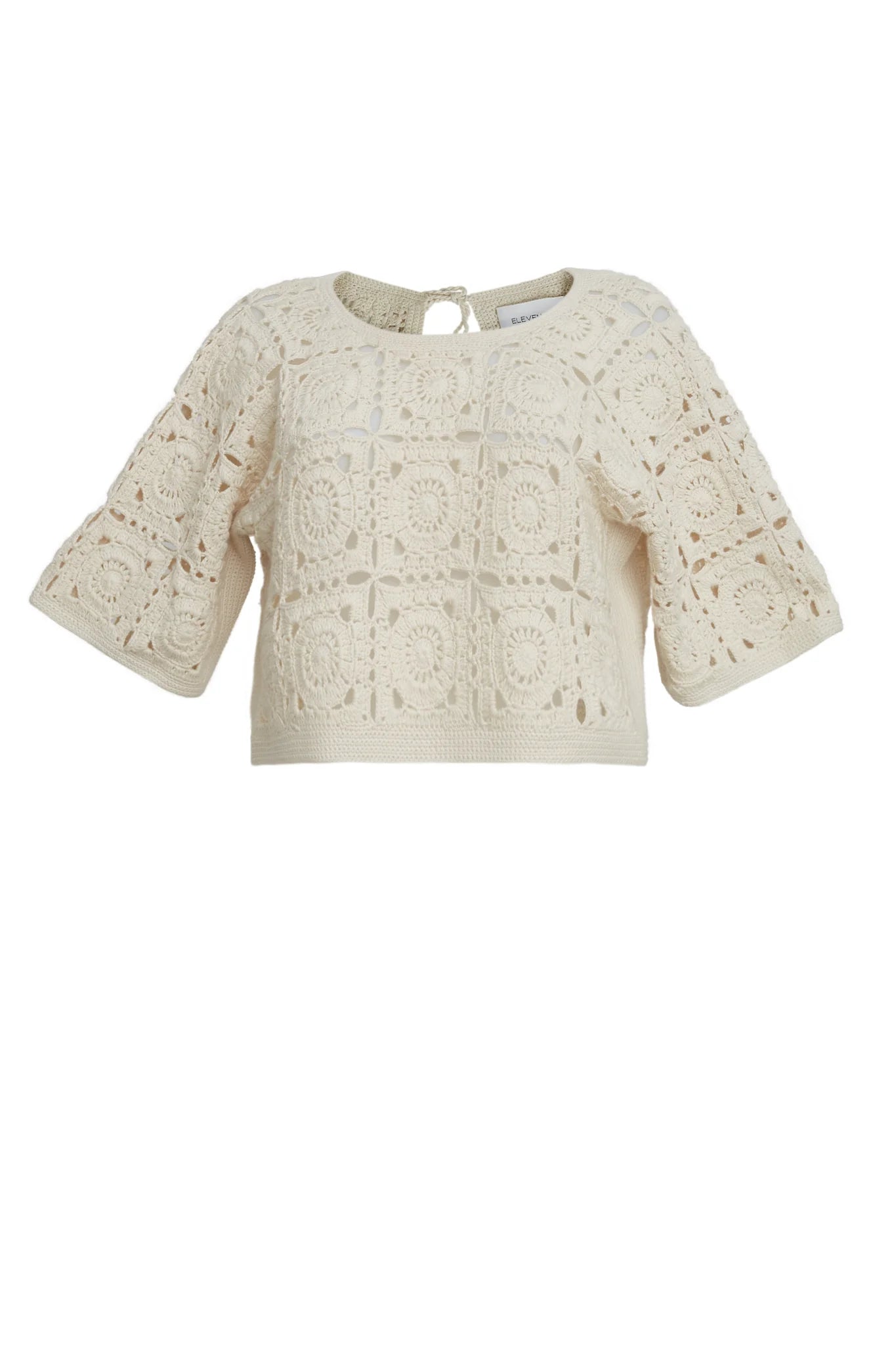 Beige lace top on a white background