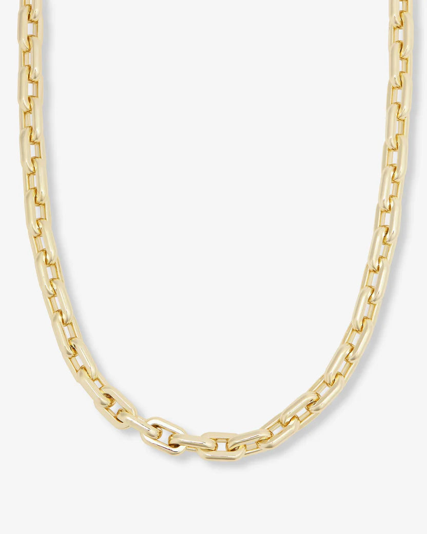 Gold chain necklace on a white background