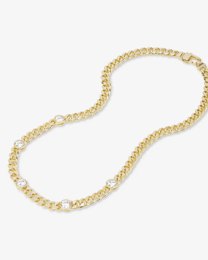 Gold chain necklace on a white background