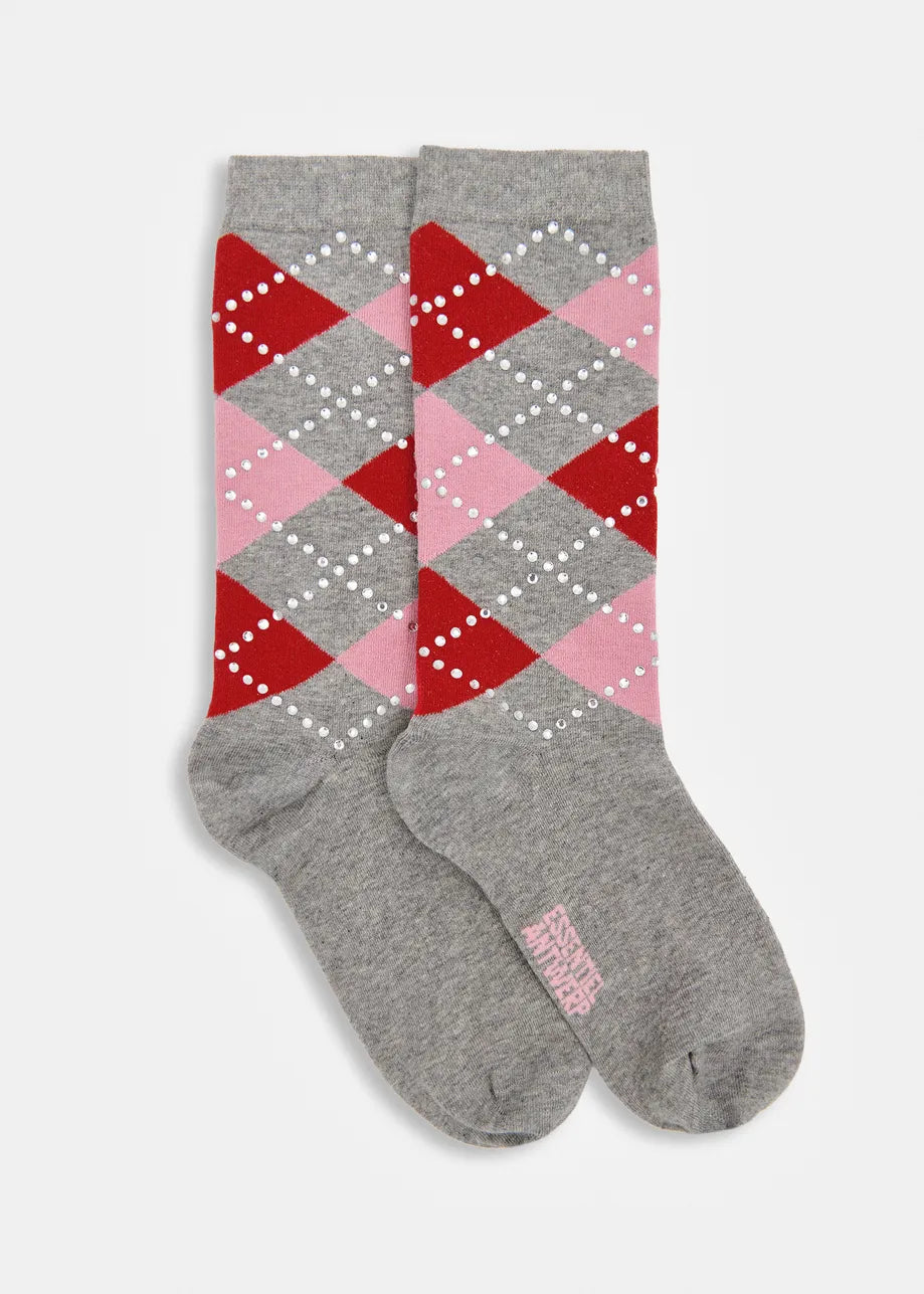 A pair of gray crew socks with an argyle pattern in red, pink, and white on the upper portion, and solid gray on the lower half.