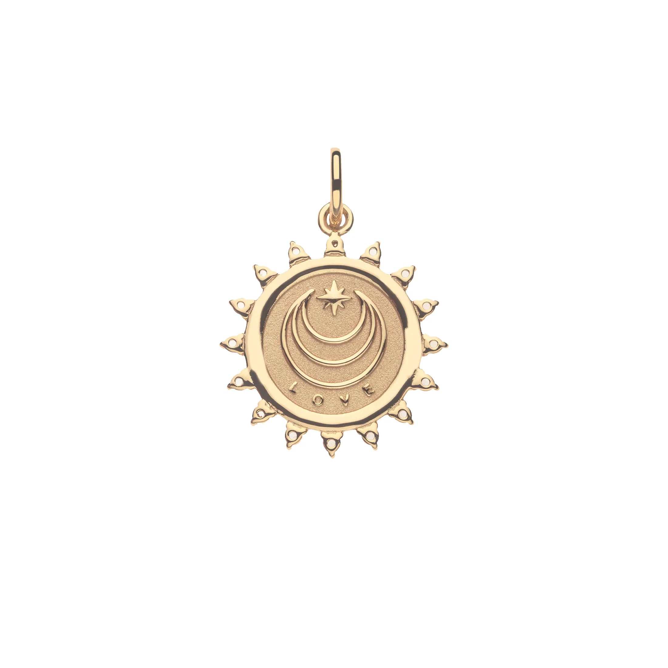 Gold pendant with celestial design on a white background