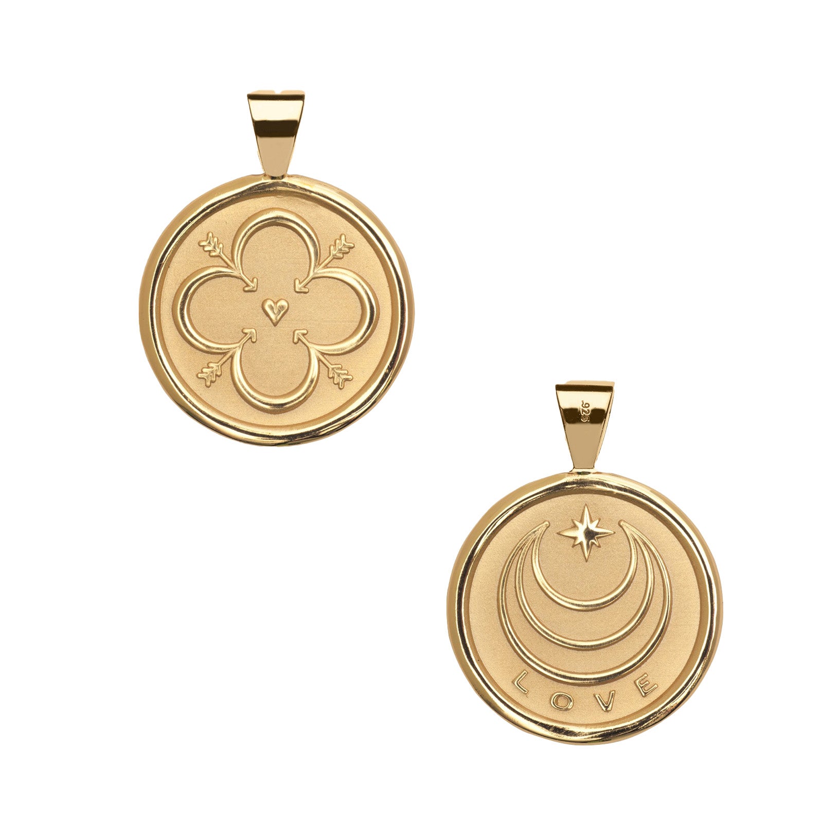 Two gold pendants on a white background