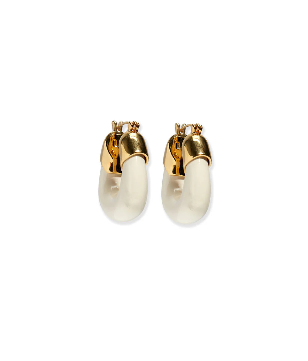 Pair of gold and white hoop earrings on a white background