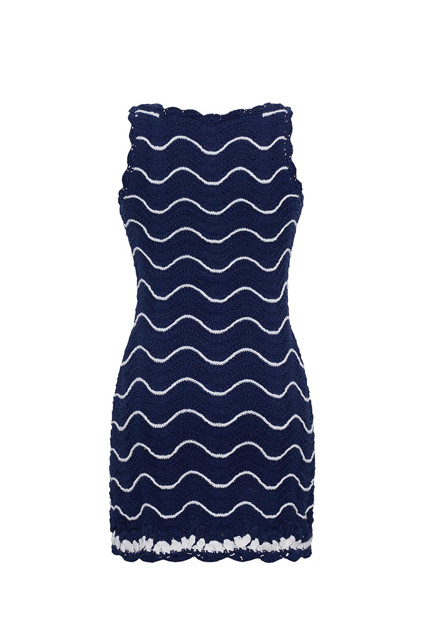 Navy dress with white wavy pattern on a white background