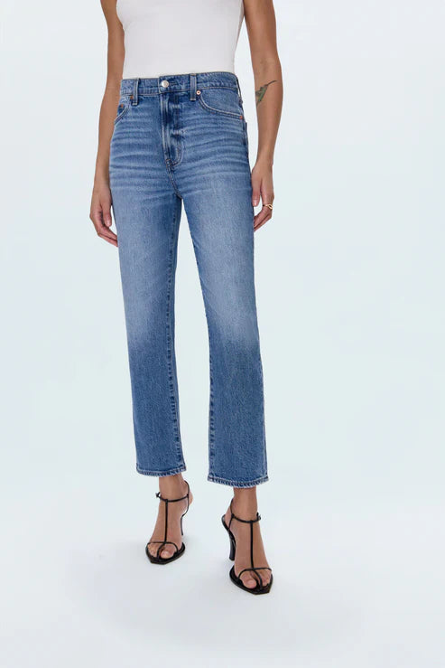 Person wearing blue jeans on a white background