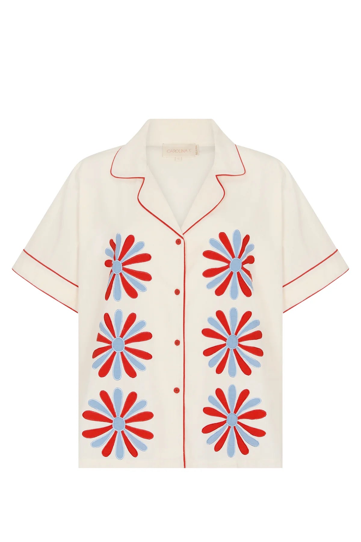 Beige shirt with red and blue floral patterns on a white background