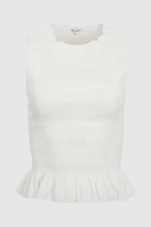 White sleeveless top with ruffled hem on a light gray background