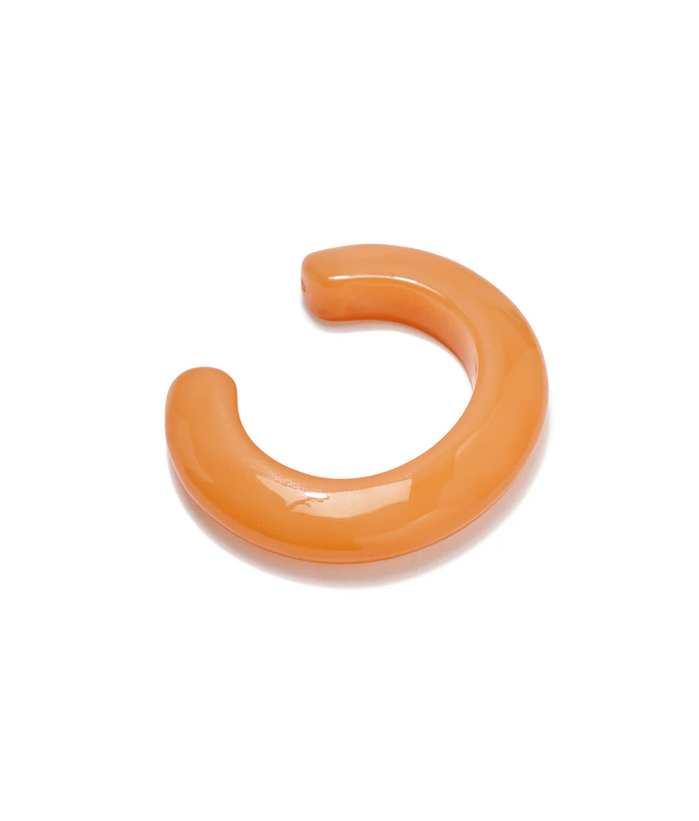 Orange plastic hook on a white background