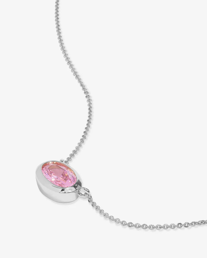 Necklace with a pink gemstone pendant on a white background