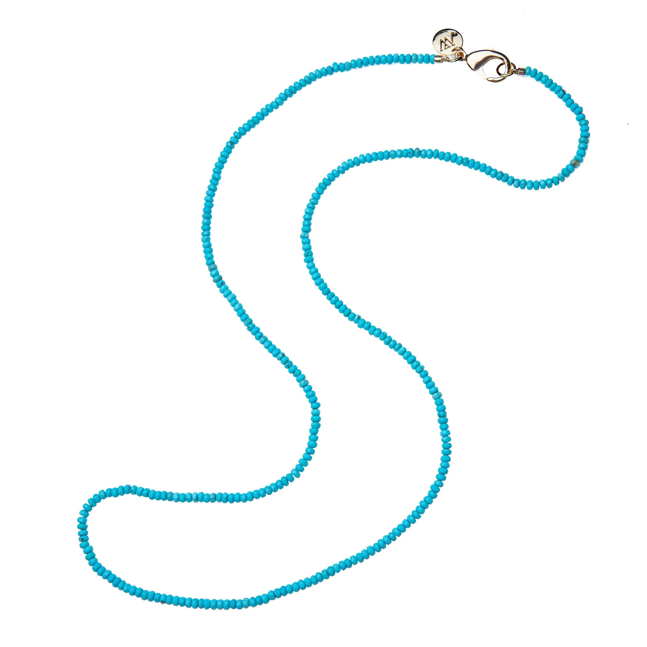 Turquoise beaded necklace with a gold clasp on a white background
