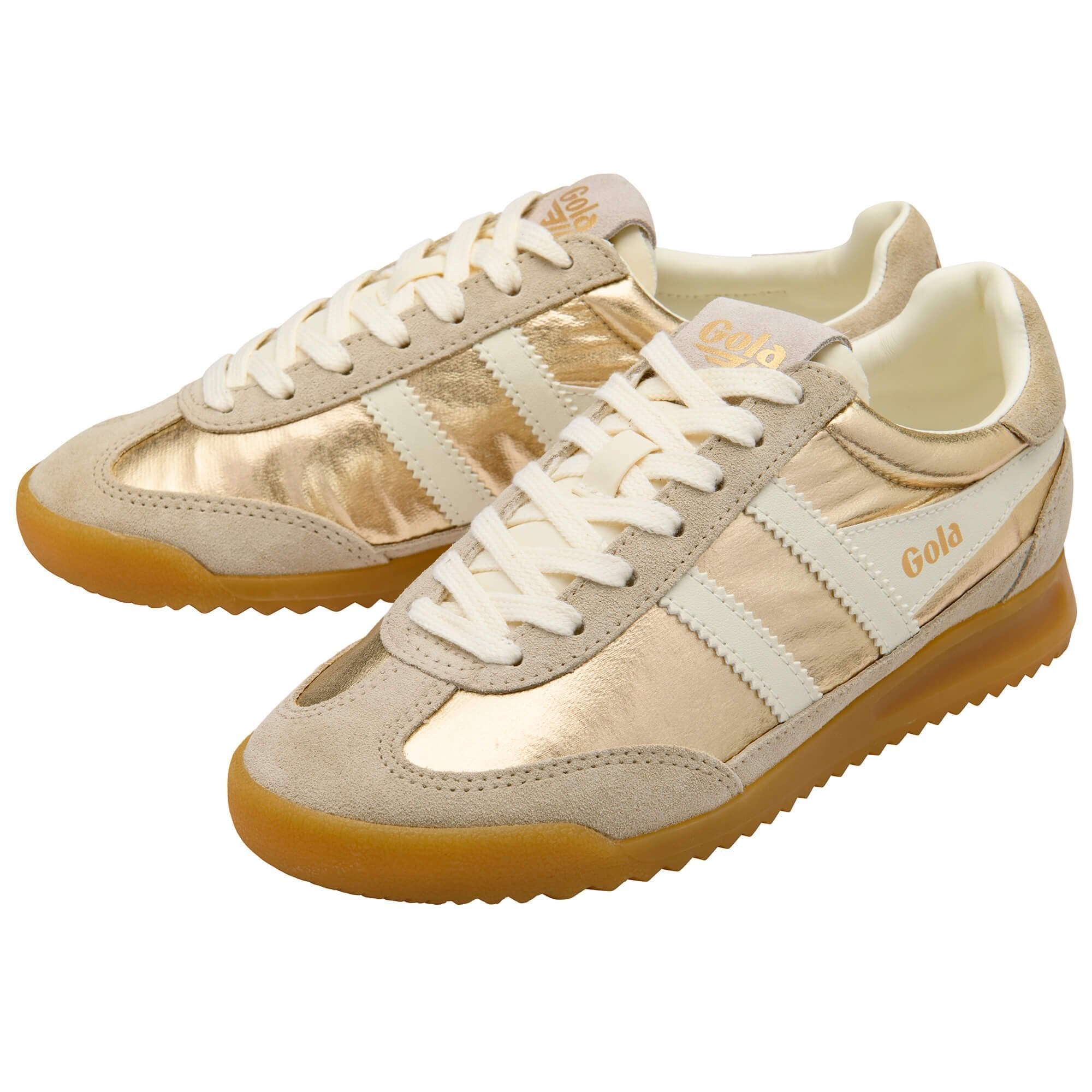 Pair of beige sneakers with white laces on a white background