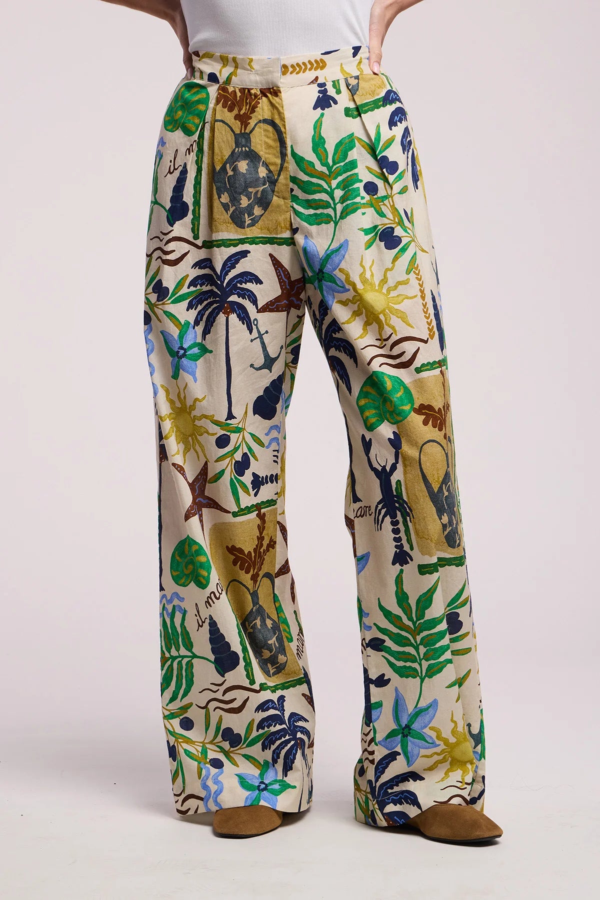 Tropical patterned pants on a plain background