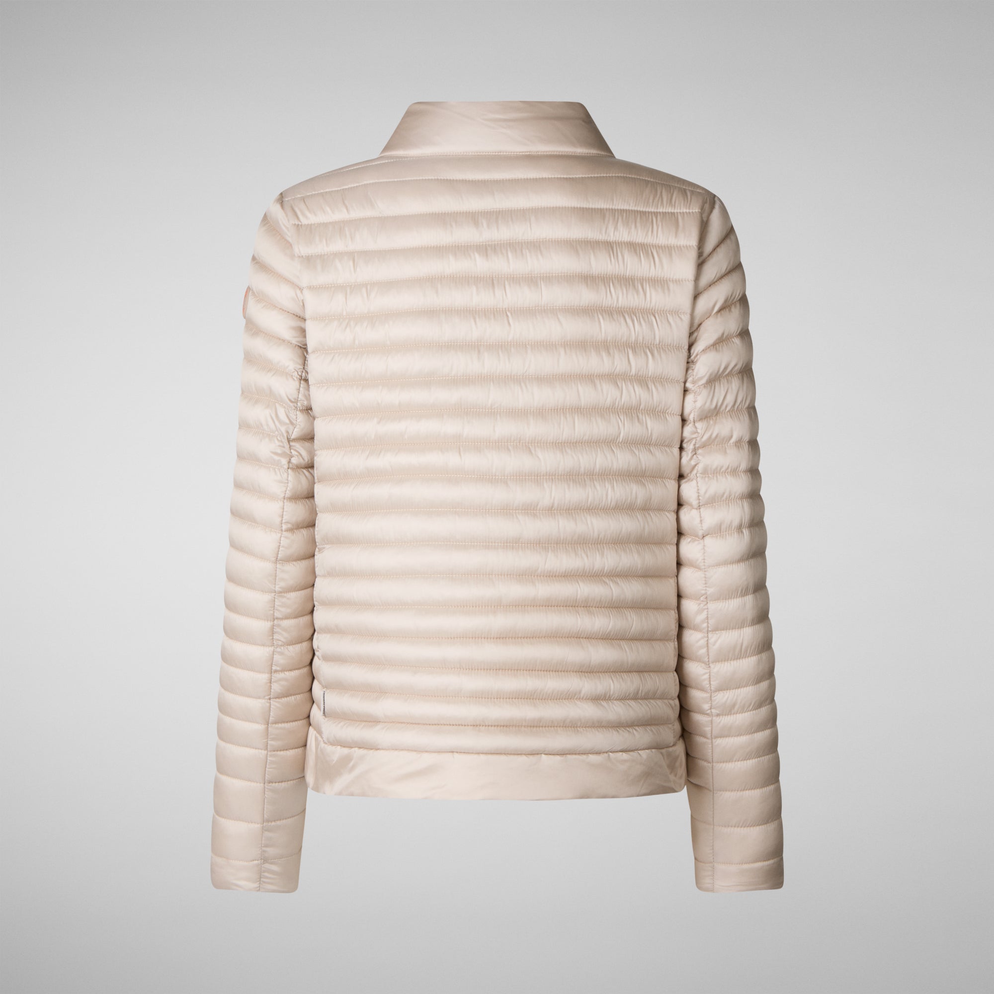 Beige puffer jacket on a light gray background