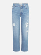 Light blue jeans with distressed details on a white background