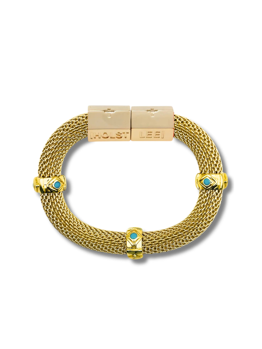 Gold bracelet with turquoise stones on a white background