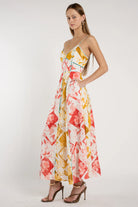 Woman wearing a floral dress on a white background