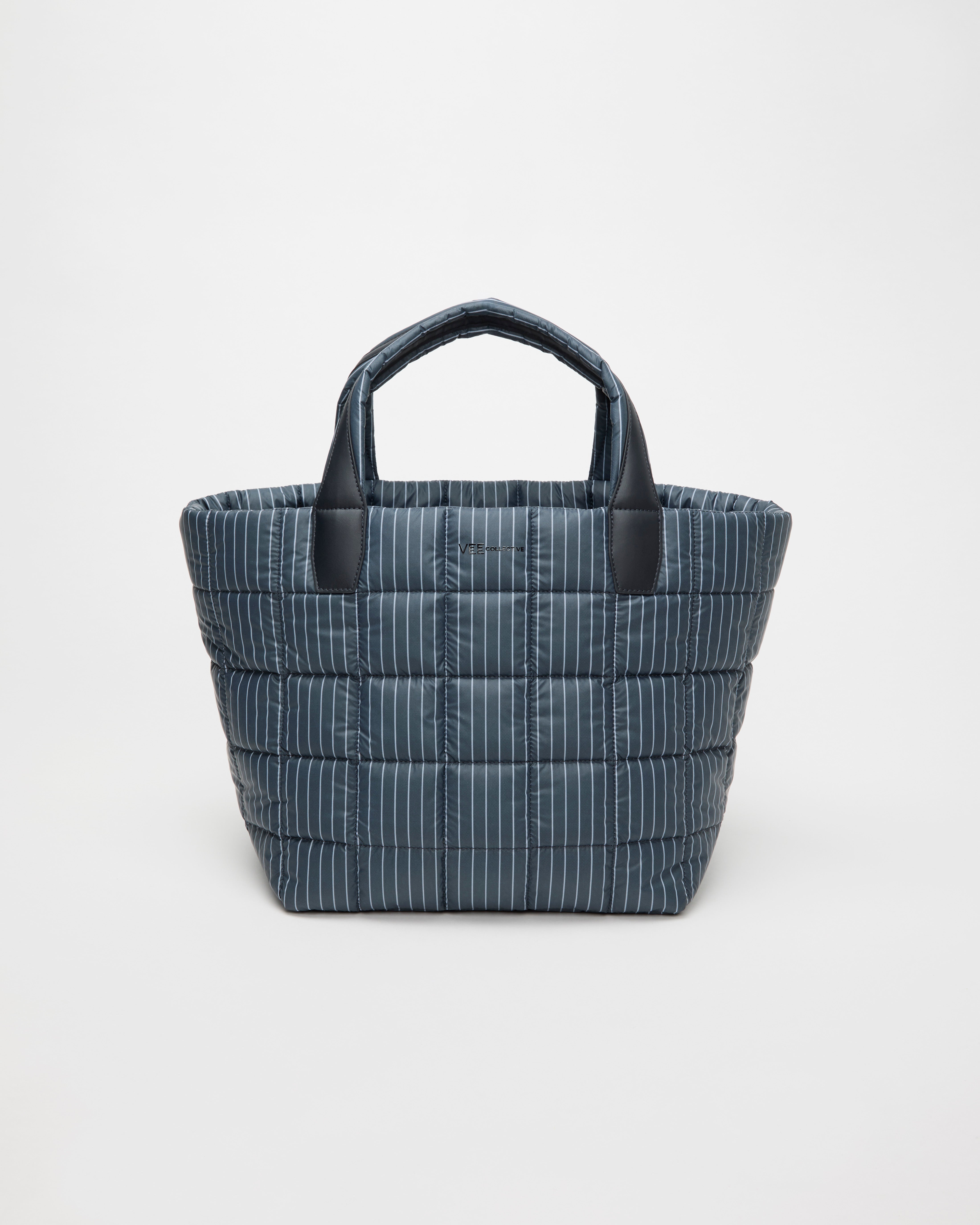 Blue striped tote bag with black handles on a white background
