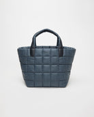Blue striped tote bag with black handles on a white background