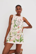 Woman wearing a floral dress on a white background