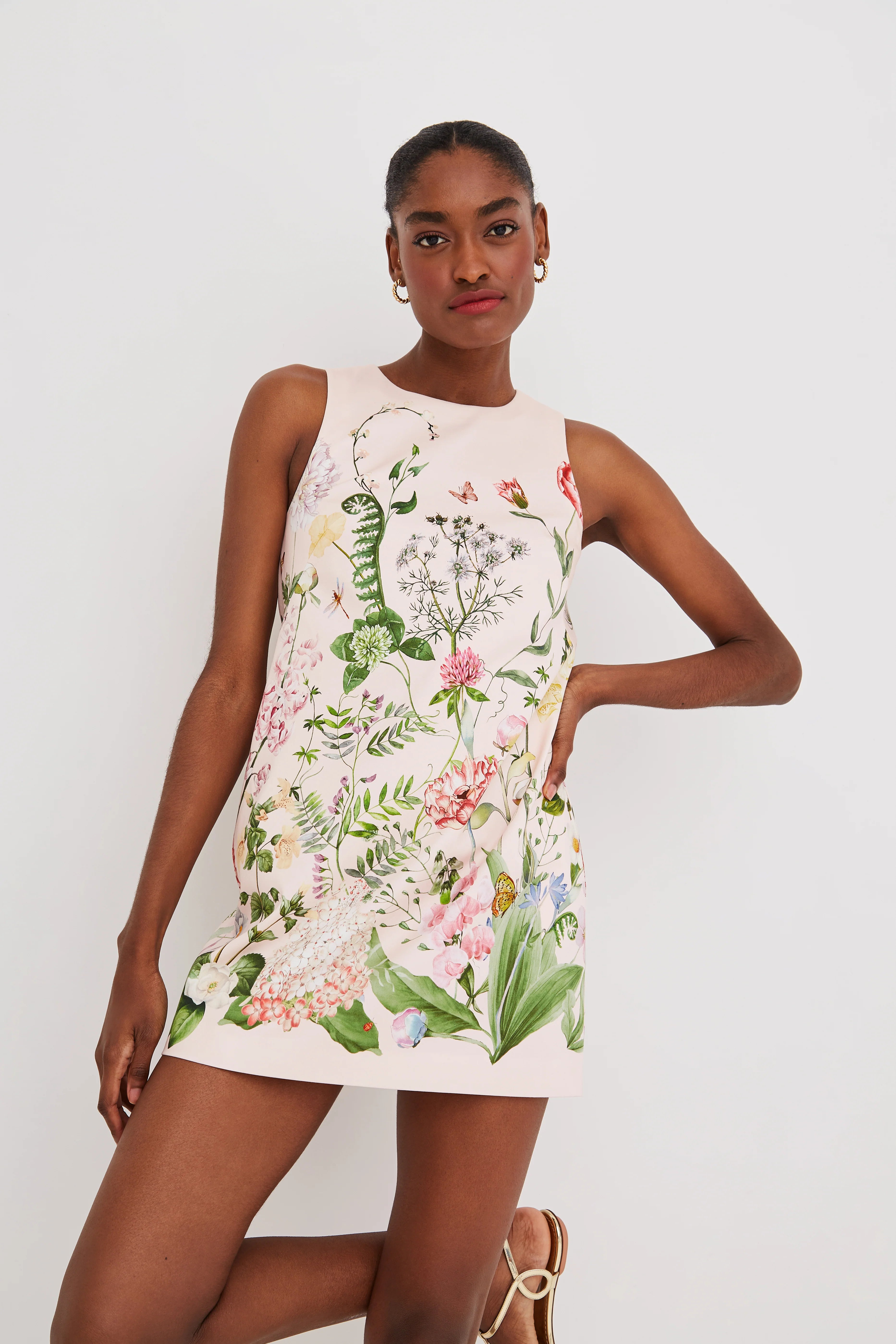 Woman wearing a floral dress on a white background