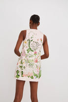 Woman wearing a floral dress with a white background