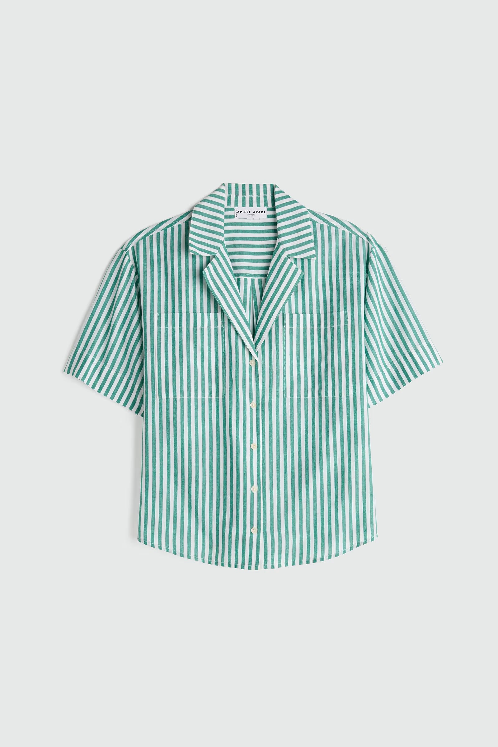 Green and white striped shirt on a light gray background