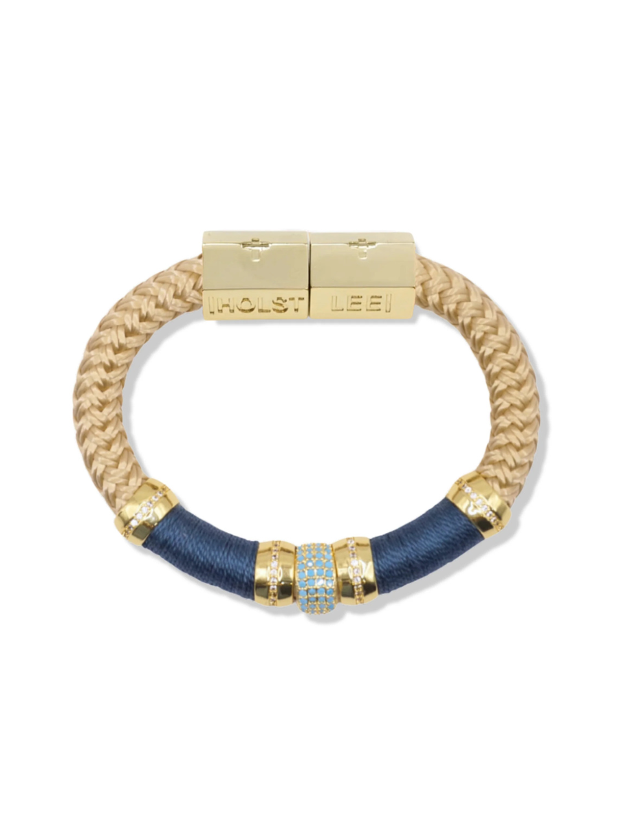 Bracelet with gold and blue accents on a white background