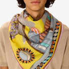 Person wearing a colorful scarf with abstract patterns on a neutral background