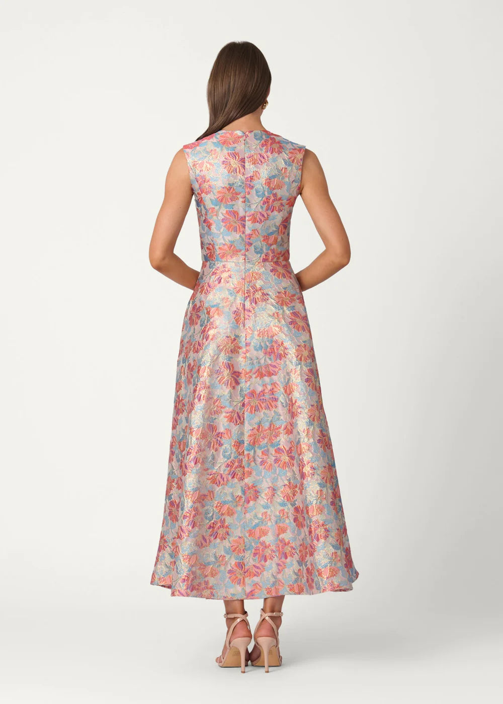 Woman wearing a floral dress on a white background