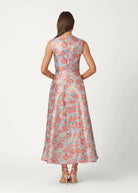 Woman wearing a floral dress on a white background