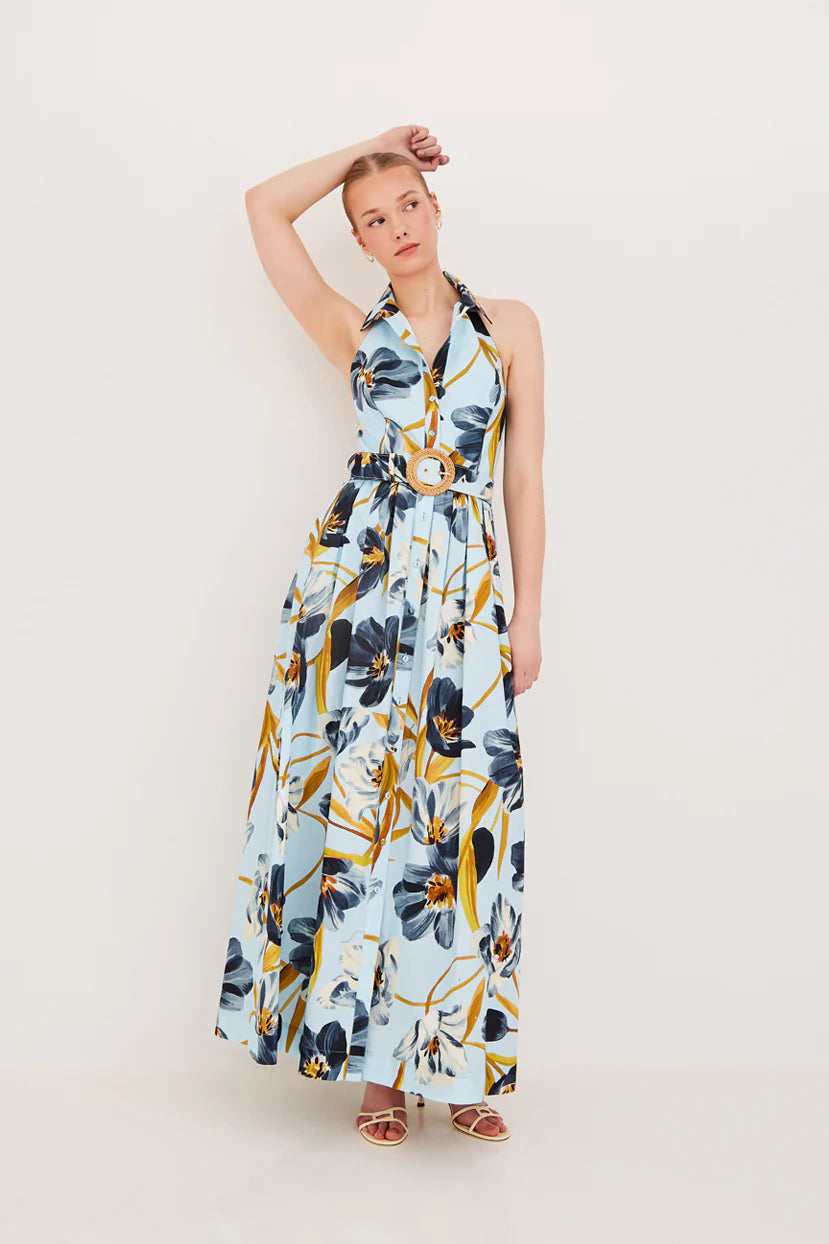 Woman wearing a floral dress on a plain background