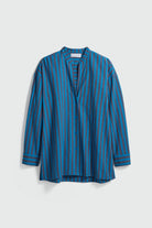 Blue striped shirt on a light gray background