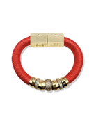 Red bracelet with gold beads and clasp on a white background