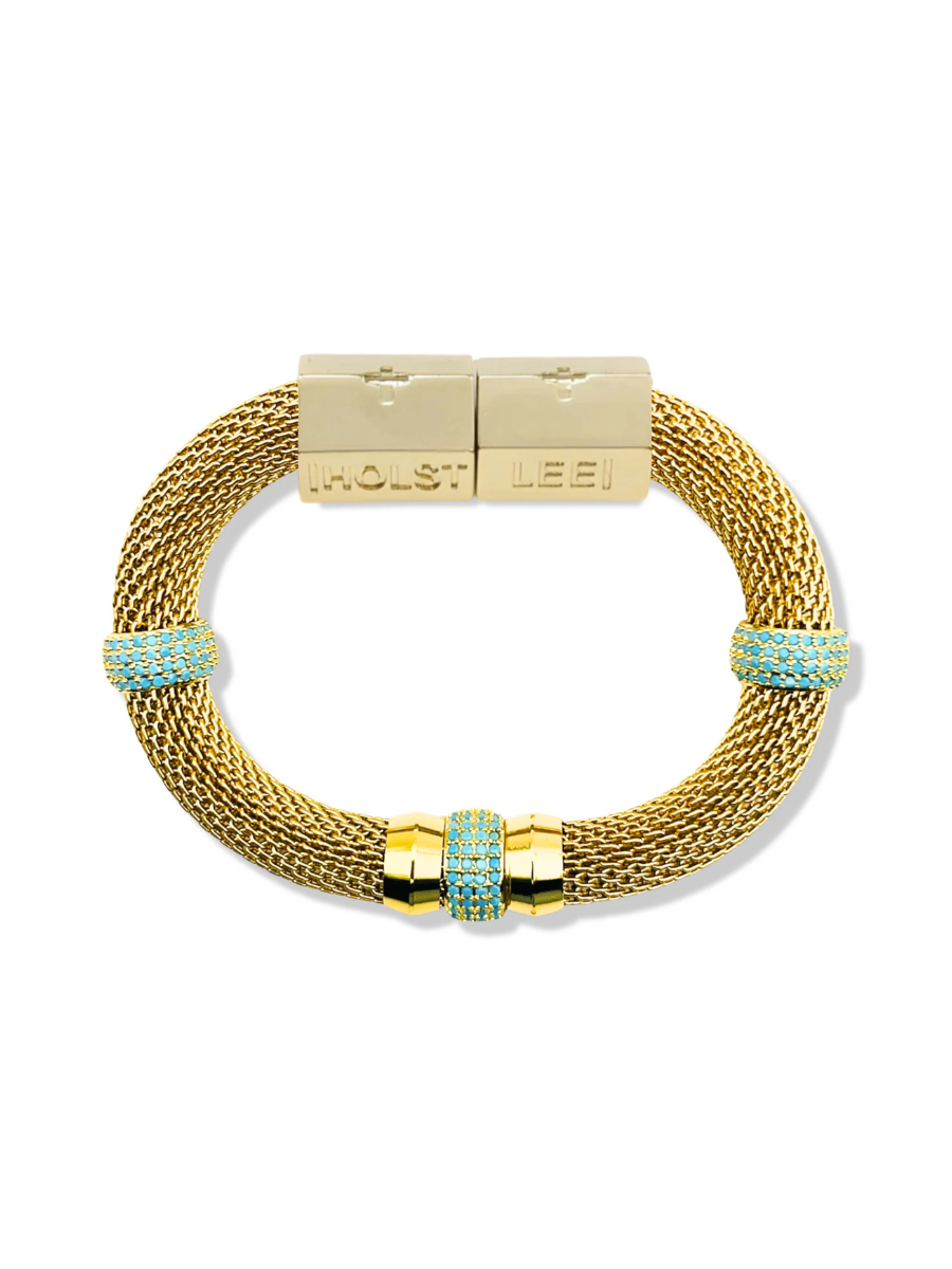Gold bracelet with turquoise accents on a white background