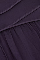 Close-up of a dark purple fabric with folds