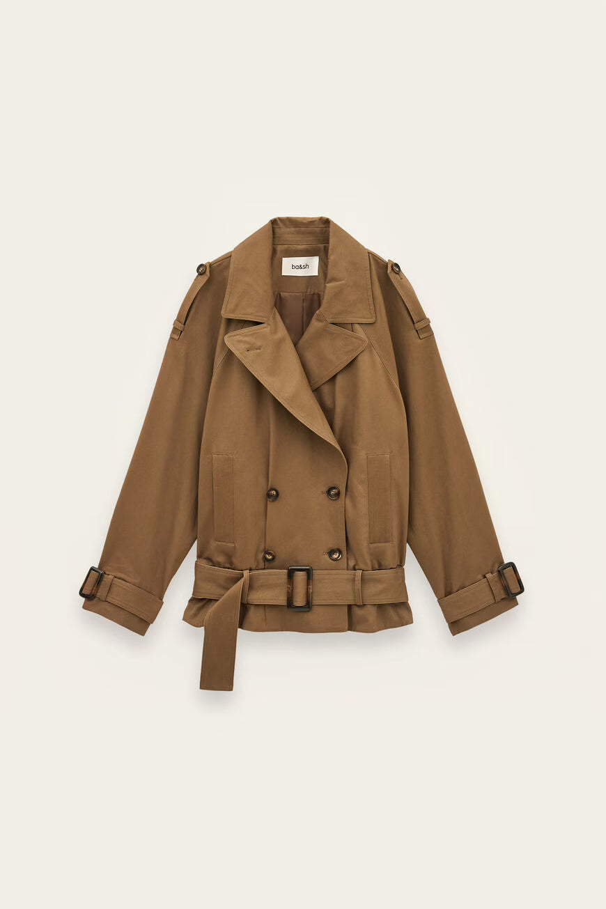 A classic double-breasted trench coat in a warm camel brown color, featuring a belted waist, wide lapels, and adjustable cuffs, displayed flat against a light cream background.